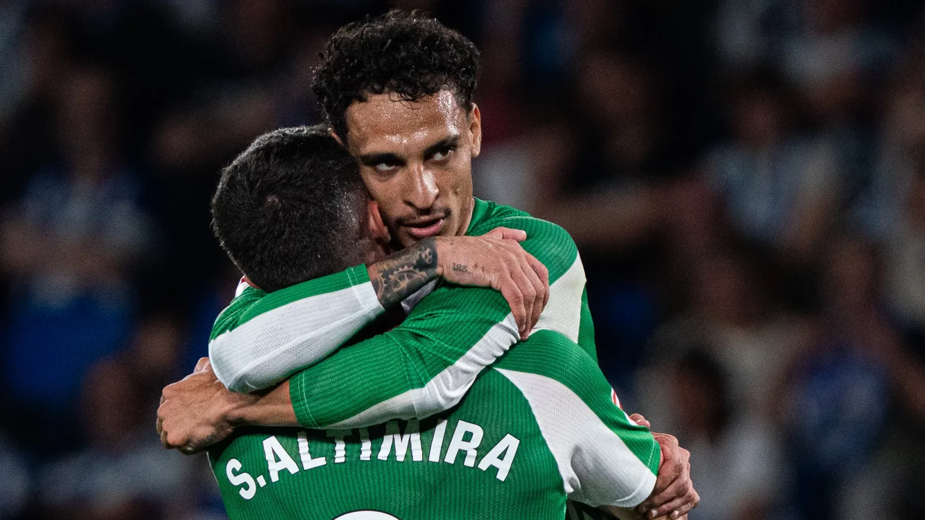 Real Betis players and supporters celebrating European qualification
