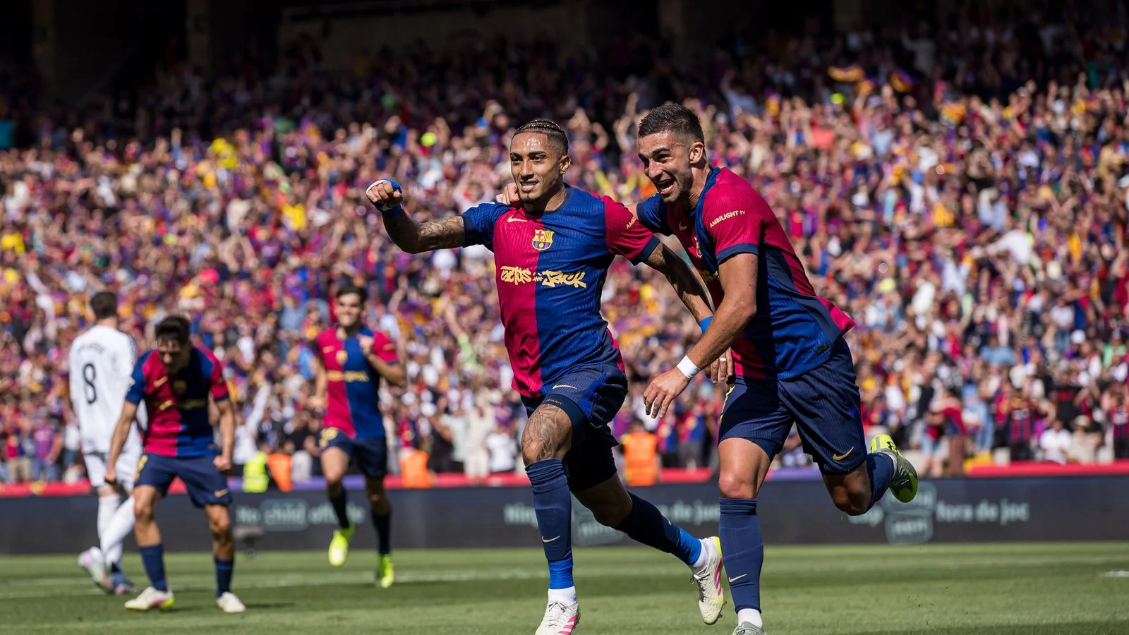 Raphinha celebrates in Barcelona's decisive 4-3 league Clásico victory