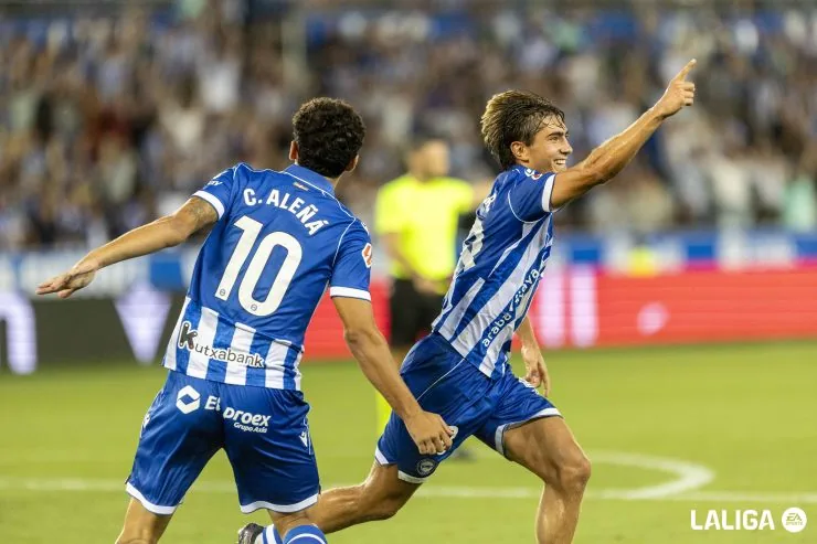 Players contest the ball during an opening-round La Liga match