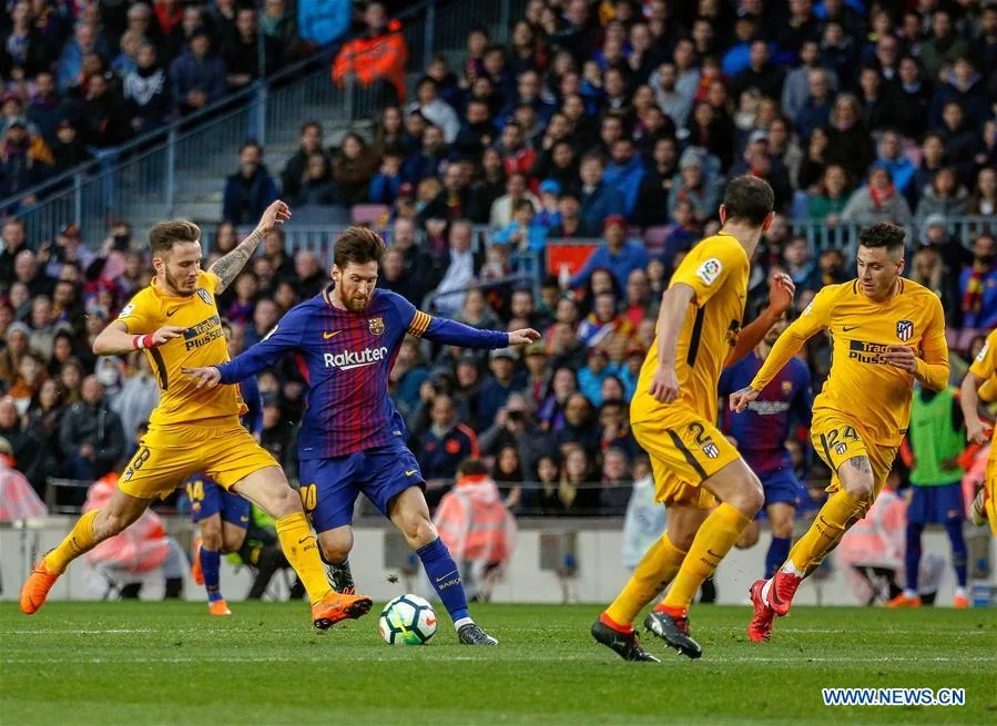 Lionel Messi carrying the ball for Barcelona during a La Liga match