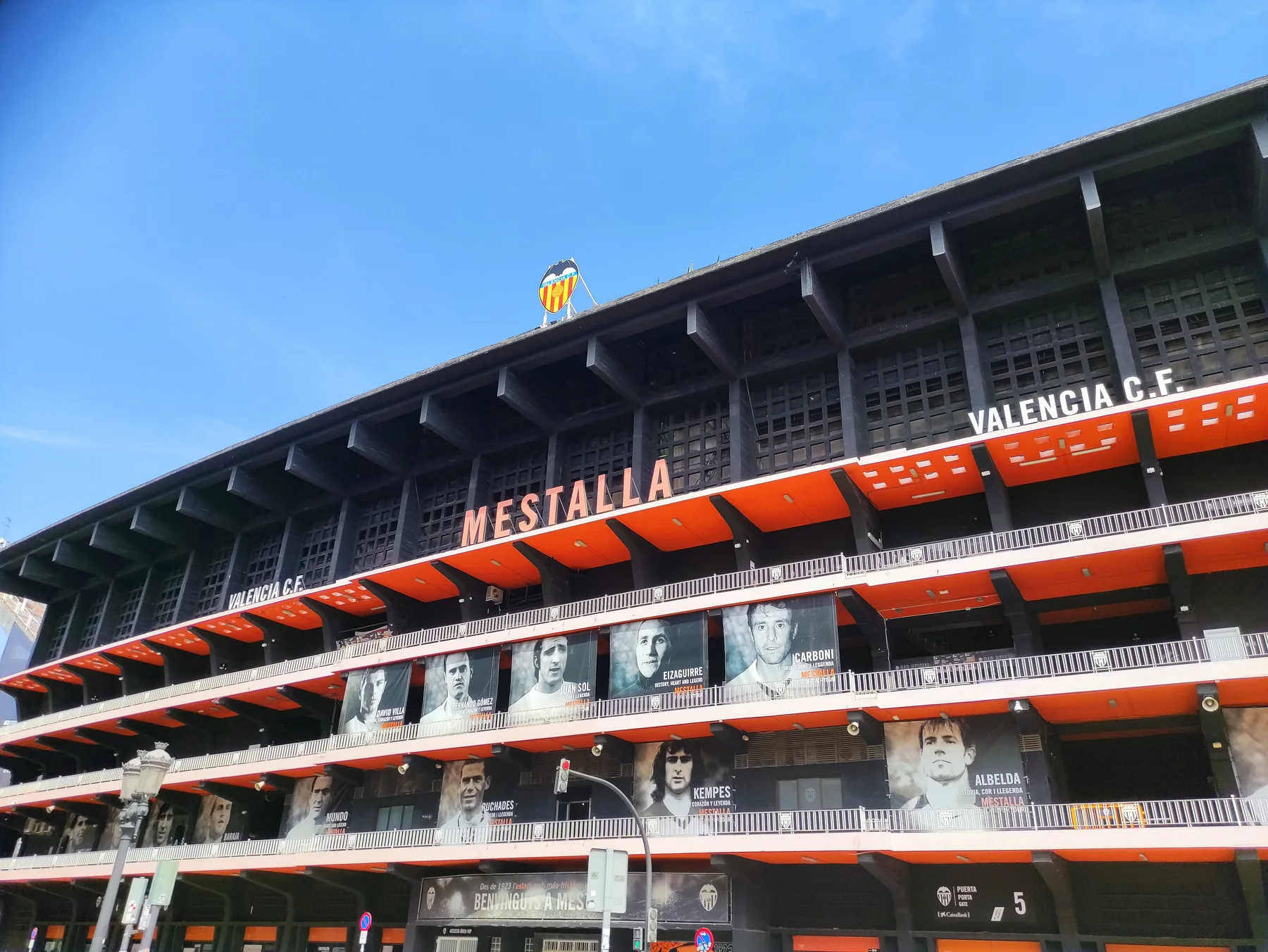 Mestalla stadium exterior with the Valencia CF bat-topped crest above the facade