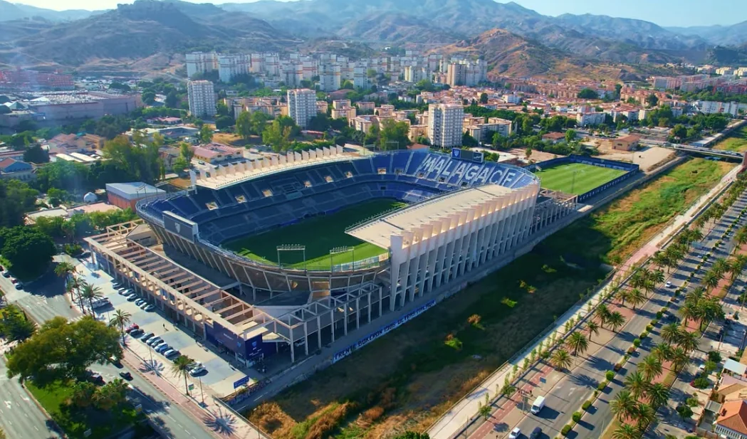 La Rosaleda stadium in Málaga surrounded by the city and hills